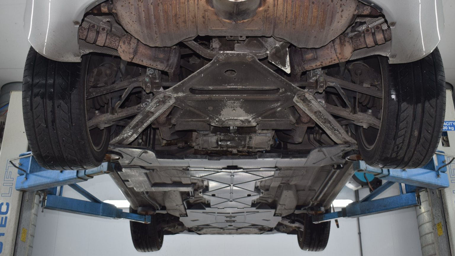 Exhaust line and axle before treatment